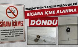 Belediyenin yangın merdiveni sigara içme alanına dönmüş!