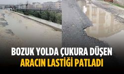 Bozuk yolda çukura düşen aracın lastiği patladı