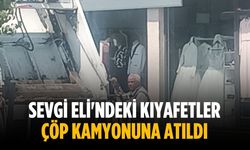 Sevgi Eli'ndeki kıyafetler çöp kamyonuna atıldı