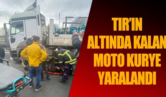 TIR'ın altında kalan motosikletli kurye yaralandı