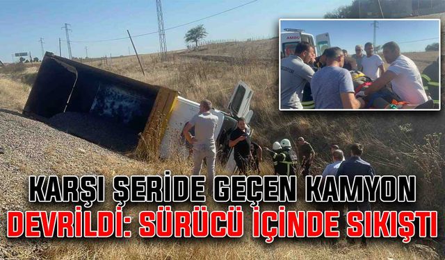 Karşı şeride geçen kamyon devrildi