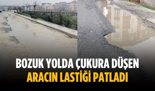Bozuk yolda çukura düşen aracın lastiği patladı