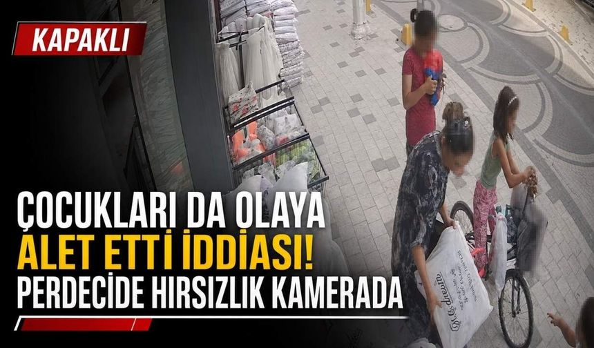 Çocukları da olaya alet etti: Perdecinin önündeki ürünleri çaldı